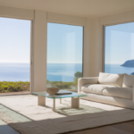 Pristine modern living room with a view of Santa Cruz coastline, symbolizing relaxation and a clean home.